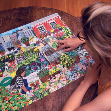 eeBoo - Piece and Love Urban Gardening 1000 Piece Square Adult Jigsaw Puzzle woman finishing puzzle